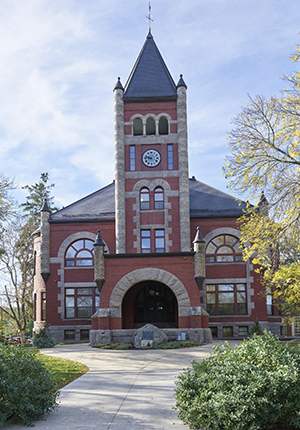 Thompson Hall, front of red brick and stone building with clock tower.