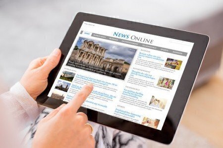Sample news website on digital tablet. Contents are all made up.