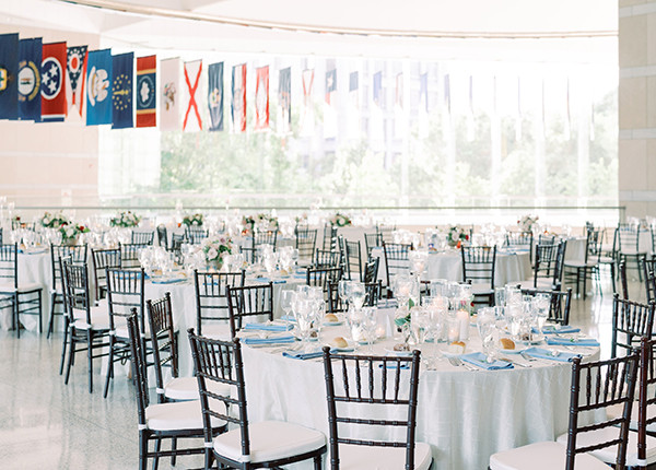 Photo of guest tables set up for wedding reception in National Constitution Center entry hall